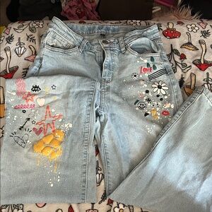 Stylish Light Blue Jeans with Colorful Accents